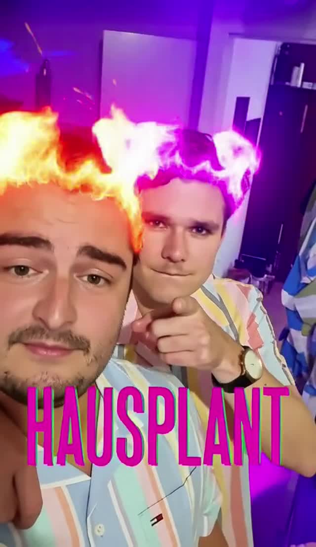 Two men with surreal flames above their heads